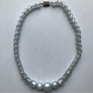 Semi-clear blue pearl necklace
